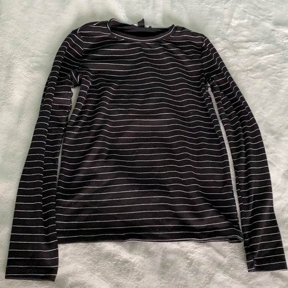 A black full sleeved shirt with white stripes. - Picture 1 of 2